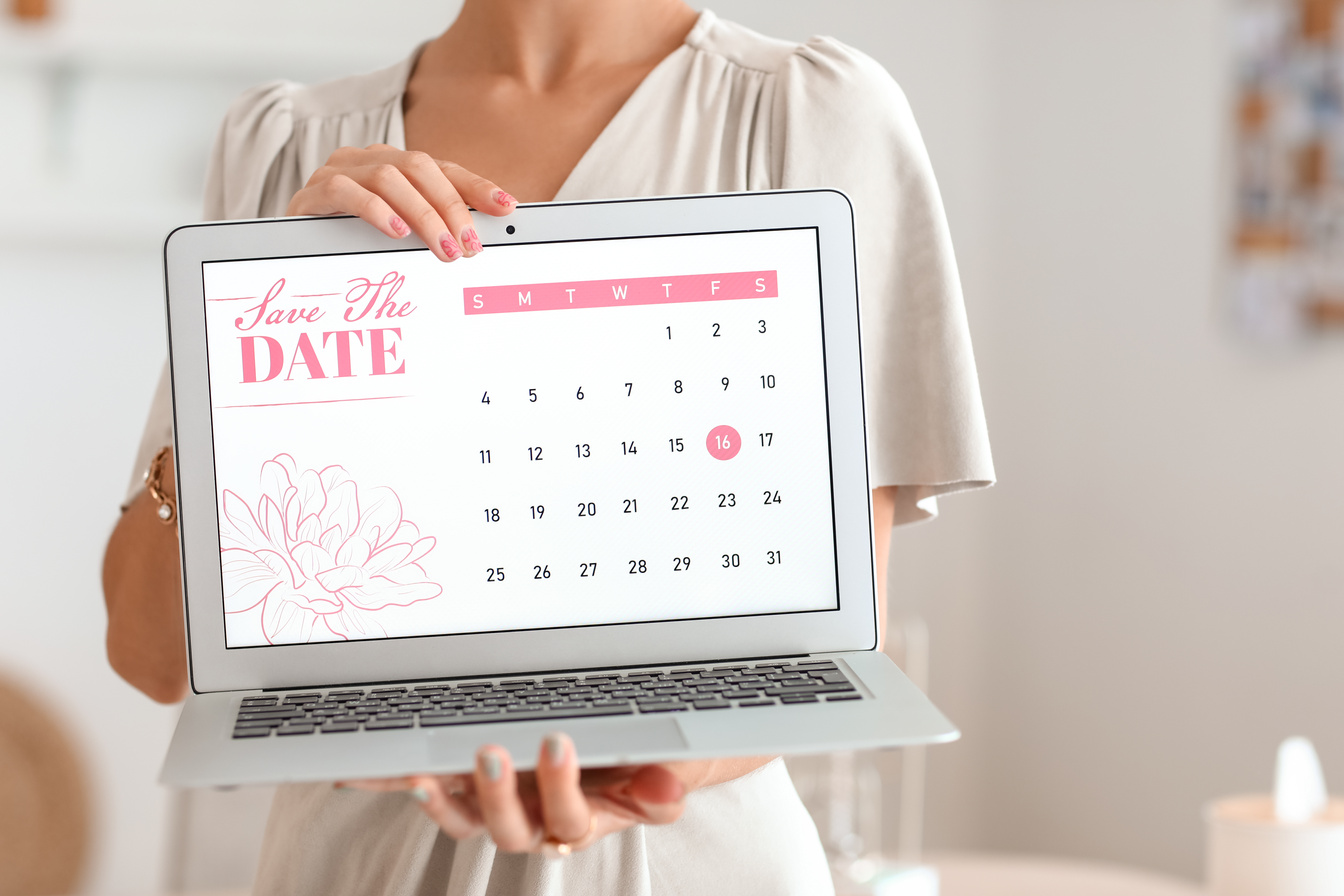 Female Wedding Planner with Laptop in Office, Closeup